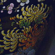 closeup of yellow chrysanthemums, from Chinese blue vase