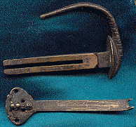 Top: tail of rat and lock catch.  Bottom: key of rat lock.