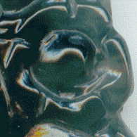 front of jade pendant: small flower magnified from the original half cm.