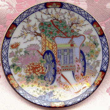 tiny plate showing decorative carriage and flowers