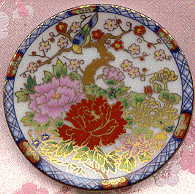 tiny plate decorated with bird and flowers