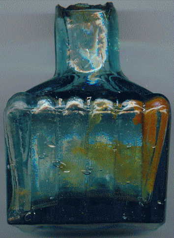 victorian pale green glass ink bottle with a few bubbles and attractive ink stains: front view
