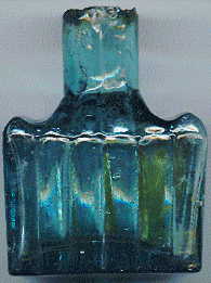 victorian pale green glass ink bottle with a few bubbles and attractive ink stains: left view