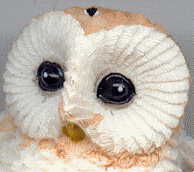 small owl ornament A: head, view from front