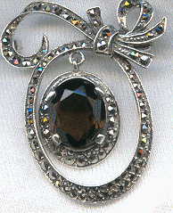 silver marcasite brooch with cut smoky quartz central pendant